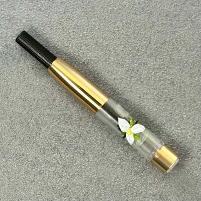 Platinum fountain pen converter with painted trillium flowers, gold trim